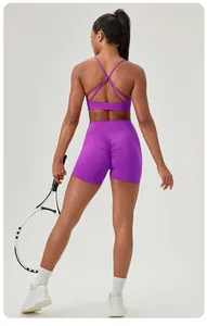 Purple yoga set with criss-cross back sports bra and high-waisted scrunch butt shorts