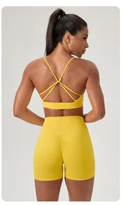 Rear view of yellow yoga set with cross-back sports bra and high waist scrunch shorts