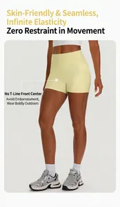 Close-up of yellow high waisted yoga shorts featuring convenient side pockets