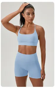 Detailed view of a light blue two-piece yoga set featuring sports bra and shorts