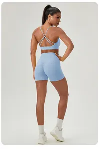 Detailed back view of a light blue yoga set featuring cross-strap bra and high waist shorts