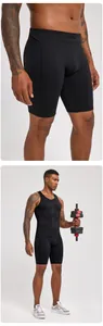 Close-up detail of men's black compression fitness set with zipper vest and shorts