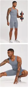 Detailed action shots showing the compression fit and grey fabric of the men's gym set