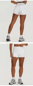 Front and back views of white high-waist yoga shorts with side pockets