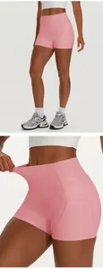 Professional elastic high-waisted pink yoga shorts with side pockets and stretch