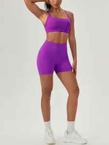 Vibrant purple two-piece yoga set featuring sports bra and high waist fitness shorts