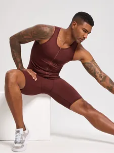Men's compression fitness set with burgundy zipper tank top and athletic gym shorts