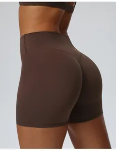 Close-up detail of brown high-waisted yoga shorts featuring a butt-lifting seam design
