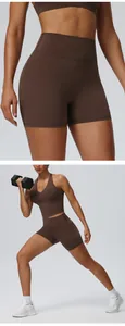 Detail of brown quick-dry yoga set with sports vest and high-waist lifting shorts