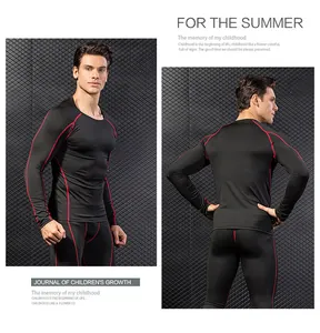 Detailed view of men's black compression sports suit with red stitching on dark mesh wall.