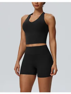 Front view of a black high-waisted yoga set featuring a sports bra and tight shorts.