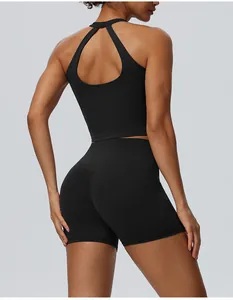Back view detail of black high-waisted yoga shorts and keyhole back sports tank top