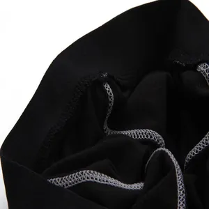 Detailed view of fleece lining and stitching on black winter sports training pants.