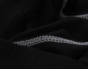 Close-up of winter thermal fleece lining and durable stitching on black athletic leggings