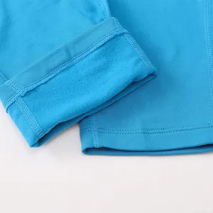 Detailed macro shot of the warm blue fleece lining and stitching on winter sports leggings