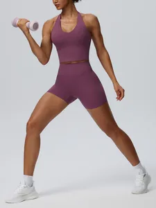 Purple naked-feel yoga set featuring a halter sports top and high-waist fitness shorts