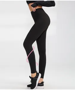 Detail of women's high-waisted black yoga leggings showing a slim side profile fit.