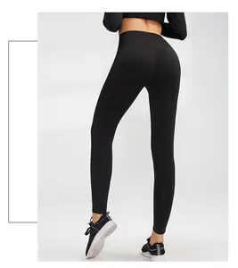 Back view of women's high-waisted black yoga leggings showing tight elastic fit.
