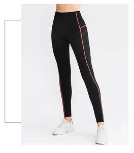 Detailed view of women's black high-waisted sports leggings featuring red contrast stitching.