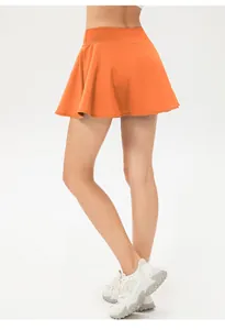 Falda pantalón deportiva naranja de secado rápido con forro interior para mujer