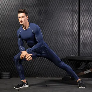 Men's navy blue quick-dry compression workout set with long sleeve shirt and leggings