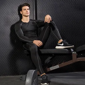 Professional men's black compression gym wear set with long-sleeved top and tight pants