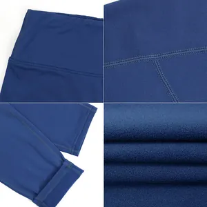 Macro details of navy blue thermal leggings showing stitching, waistband, and soft fleece lining