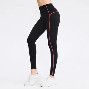Women's high waisted thermal sports leggings with red stitching for yoga and fitness.