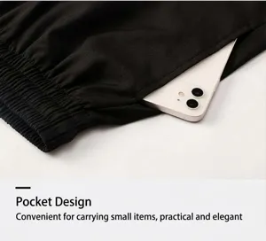 Detail showing the side pocket of black 2-in-1 fitness shorts with a smartphone