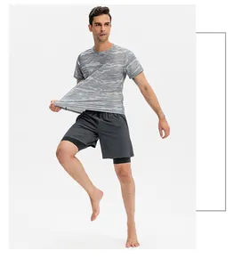 Detail view of men's quick-dry double-layer sports shorts with grey camo t-shirt style.