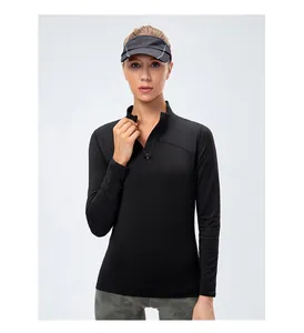 Women's black slim fit athletic long sleeve top with stand collar and front zipper detail