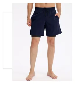Close-up front view of men's navy blue double-layer sports shorts worn by a model