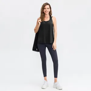 Losse yoga tanktop voor dames en sportleggings met hoge taille voor fitnesstraining.