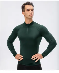 Professionele donkergroene thermische fitness top met lange mouwen voor heren met slim fit design