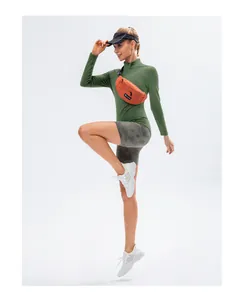 Detail view of women's dark green high-elastic stand collar yoga top on model