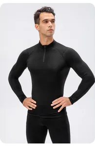 Close-up of men's black compression fitness top with quarter zipper and high-elastic fabric