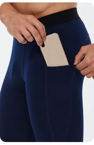 Detail of men's thermal compression leggings showing functional side pocket for phone