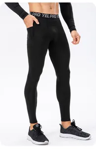 Close-up detail showing the side pocket on men's black athletic compression training leggings