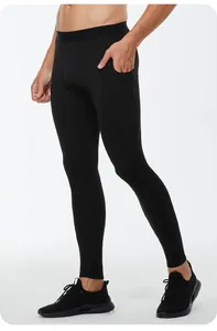 Side view of men's black compression leggings featuring a convenient phone pocket.