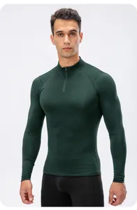 Frontal view of men's dark green quarter-zip athletic compression long sleeve top