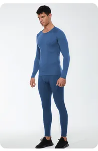 Detail view of men's blue thermal compression fitness suit on an athletic model