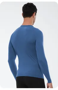 Back view of a blue men's thermal compression shirt for winter fitness and sports