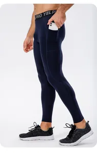 Detail view of men's blue compression leggings with functional side phone pocket