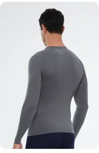 Back view of a grey men's compression athletic top showing fabric texture and fit