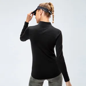 Women's fleece-lined black sports long sleeve top for fitness and yoga, back view