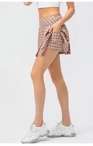 Detail of pink plaid pleated sports skort with hidden pockets for tennis or yoga
