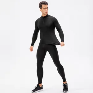 Professional men's black compression fitness suit with half-zip top and elastic leggings
