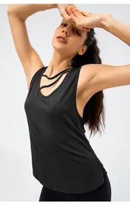 Detail view showing the breathable fabric and strappy neckline of this black yoga tank top