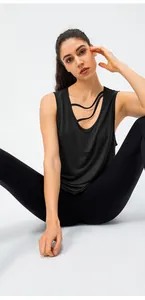 Detailed view of women's black loose yoga tank top with stylish neckline straps