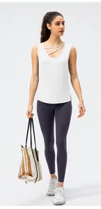 Full view of women's white breathable quick-dry yoga tank top with cross strap neckline